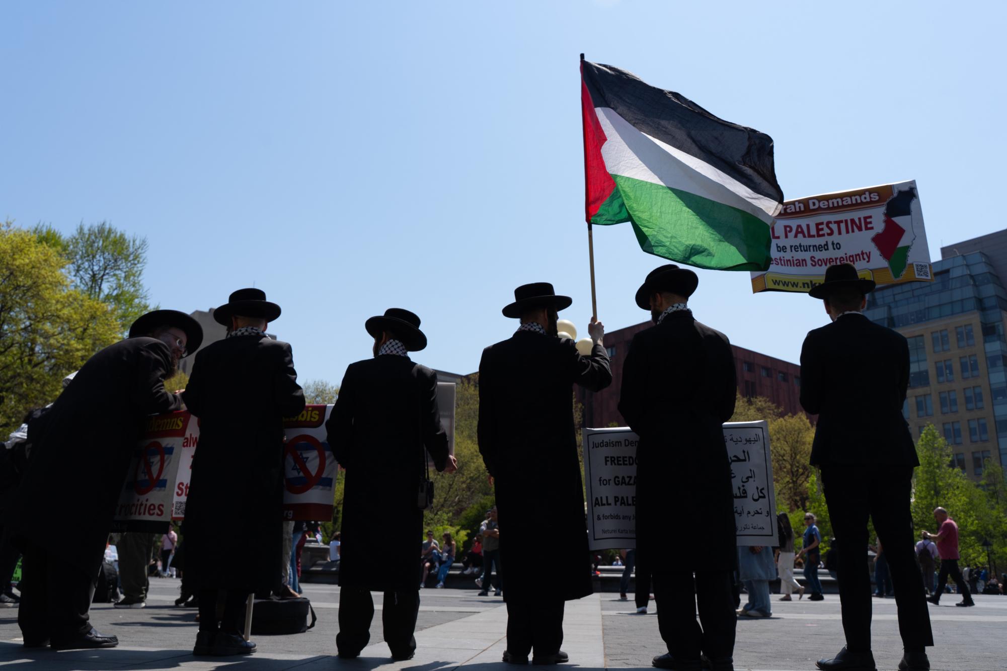 Students hold cross-campus march for divestment, noncitizen support